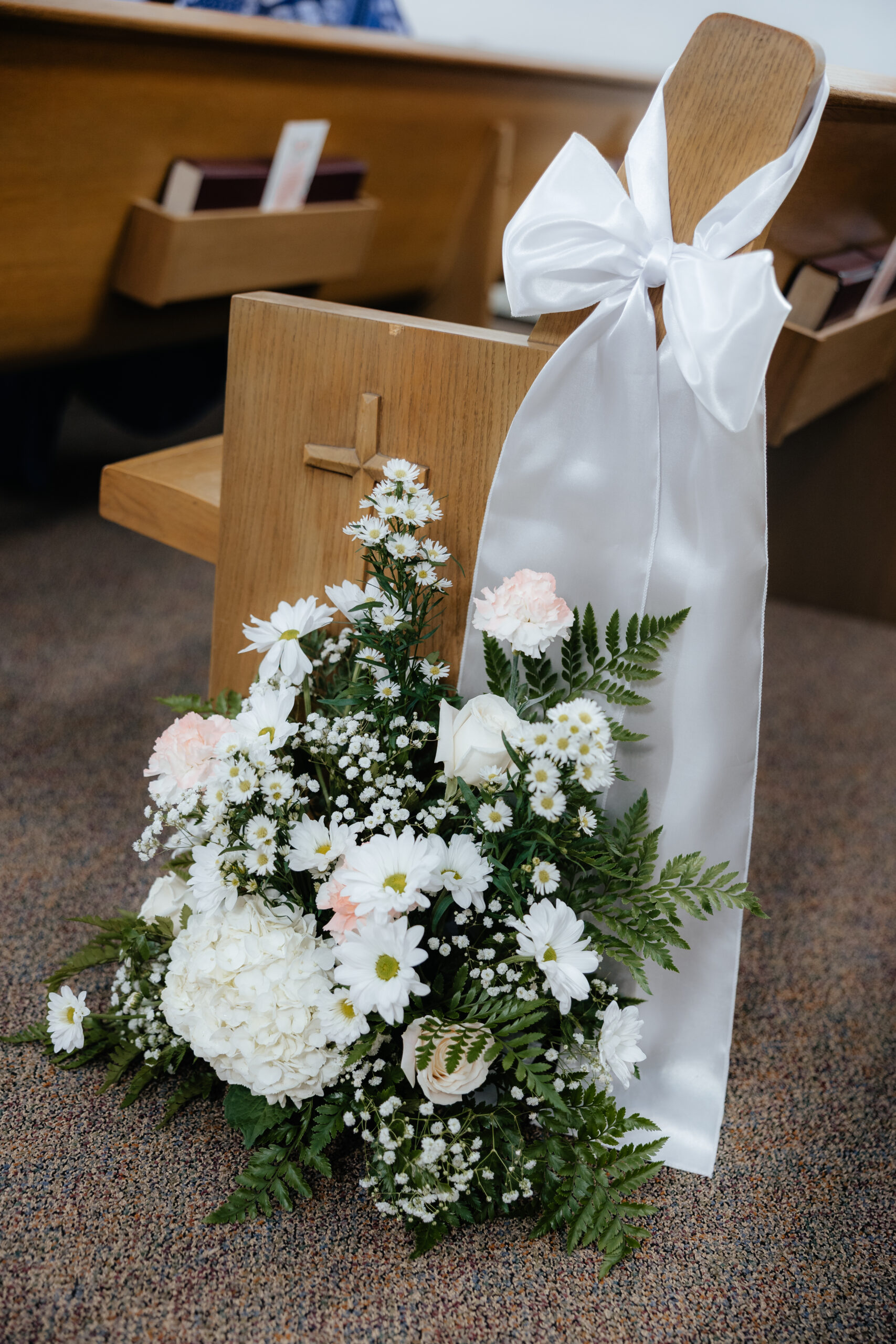 An aisle marker of a floral arrangement.