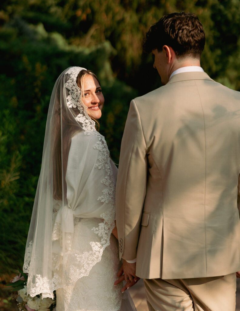 A bride and groom posing together.