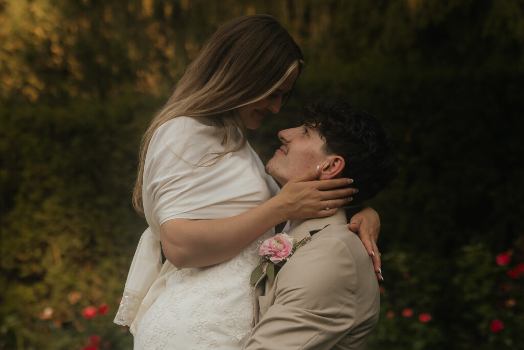 A groom picking up his bride.